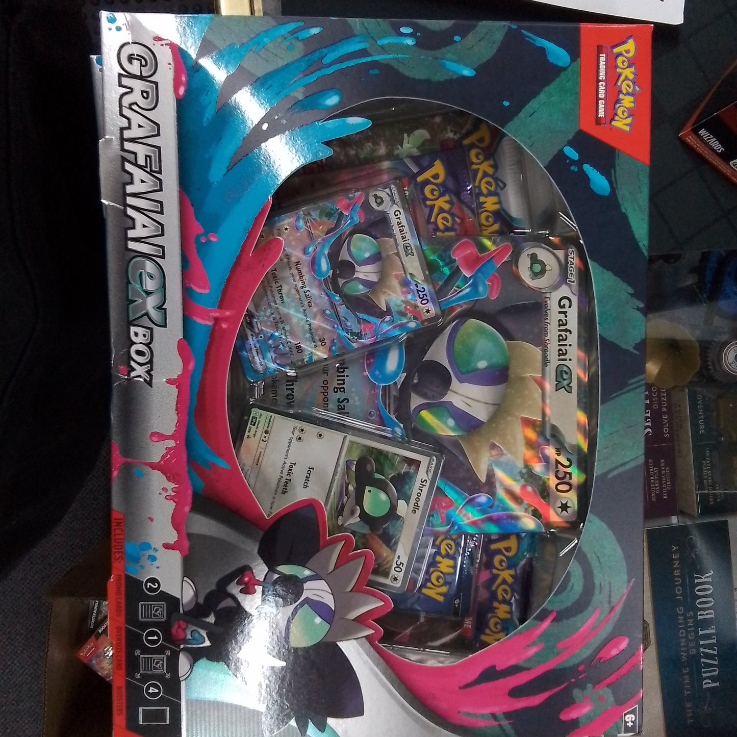 Grafaiai EX box collection image displaying rare Pokémon cards, exclusive promo cards, and stunning artwork, perfect for collectors and trainers seeking premium additions to their Pokémon card collection.